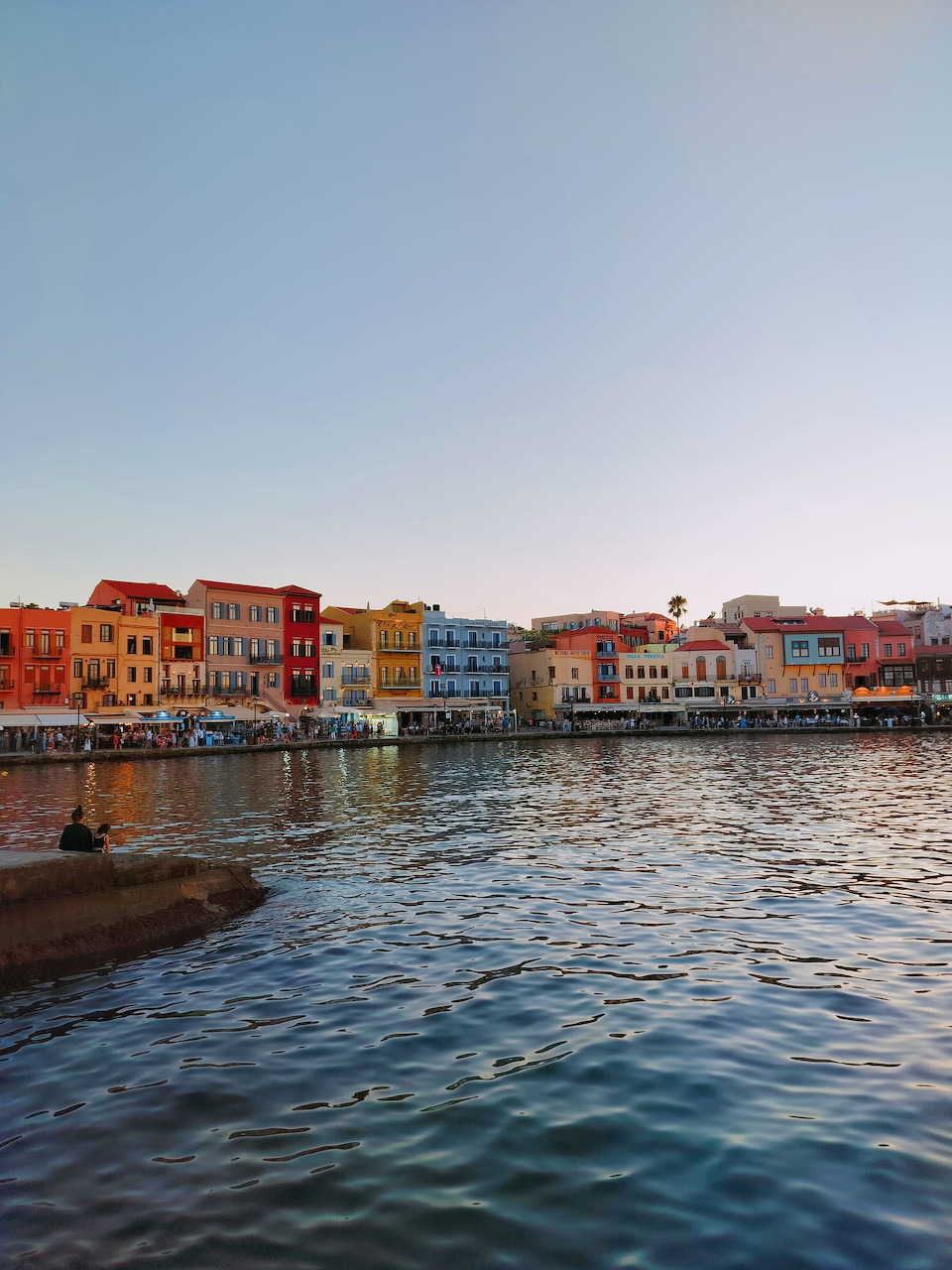 Chania old Venetian harbor with lighthouse in Crete, Greece