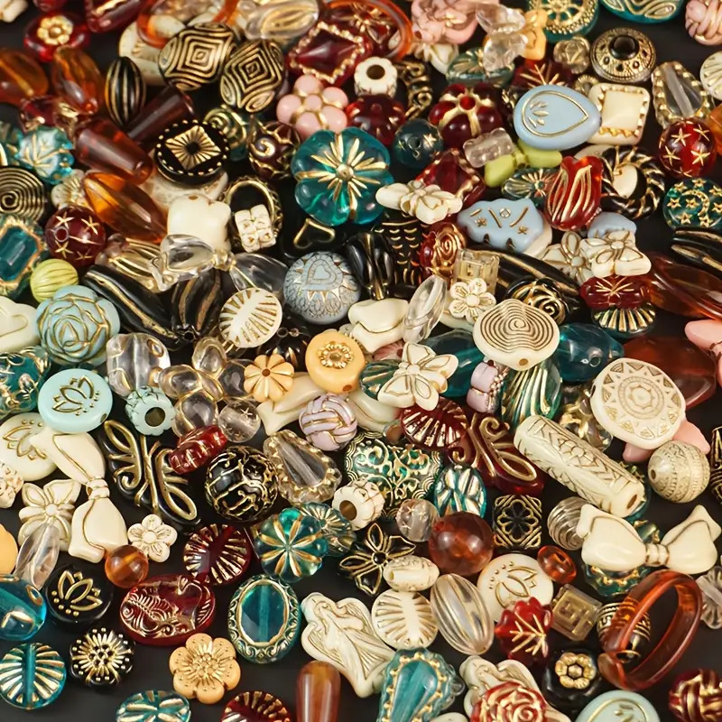 Overhead view of densely packed vintage jewelry pieces and decorative buttons in varied colors and patterns