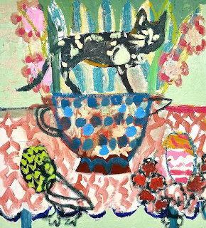 Folk art painting of black cat on table with colorful patterned dishes and flowers