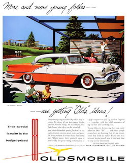 Vintage 1956 Oldsmobile advertisement with illustrated two-tone car and suburban family scenes