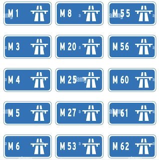 Grid of 15 blue rectangular motorway signs showing route numbers M1, M3, M4, M5, M6, M8, M20, M25, M27, M53, M55, M56, M60, M61, M62