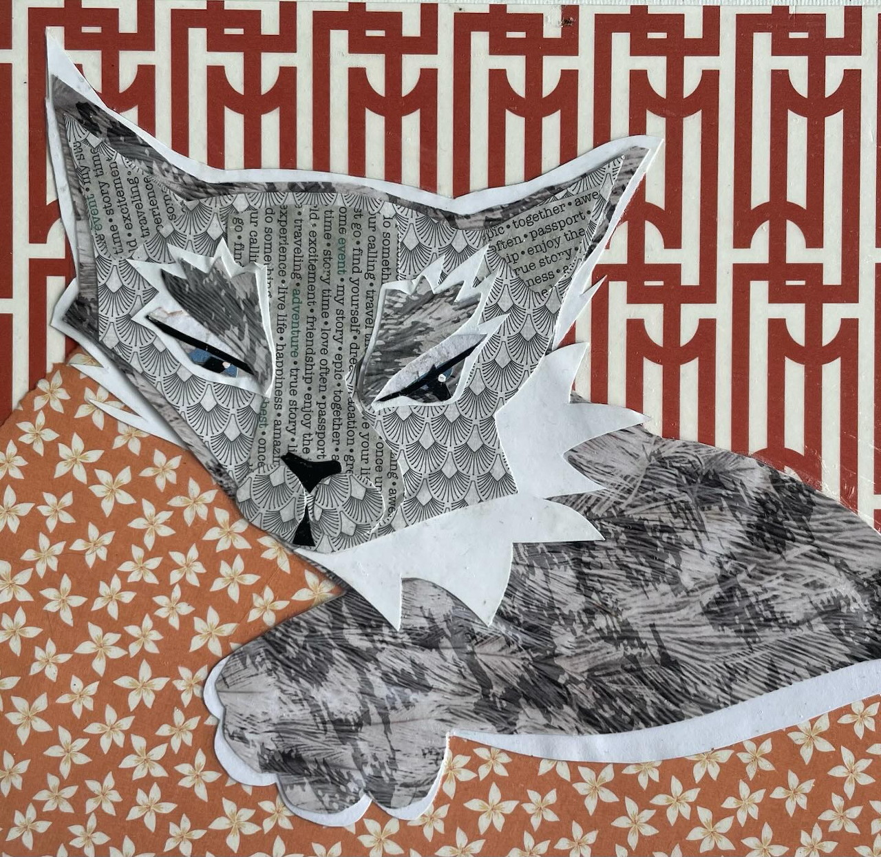 Collage art of a cat made from newspaper and patterned paper on decorative background