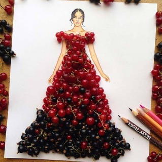 Fashion sketch with a dress made from red and black berries on white paper