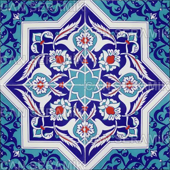 Blue and white ornamental tile pattern with an eight-pointed star and floral motifs