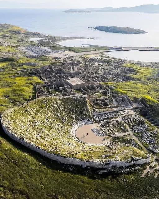 Small rocky island of Delos in the blue Aegean Sea near Mykonos