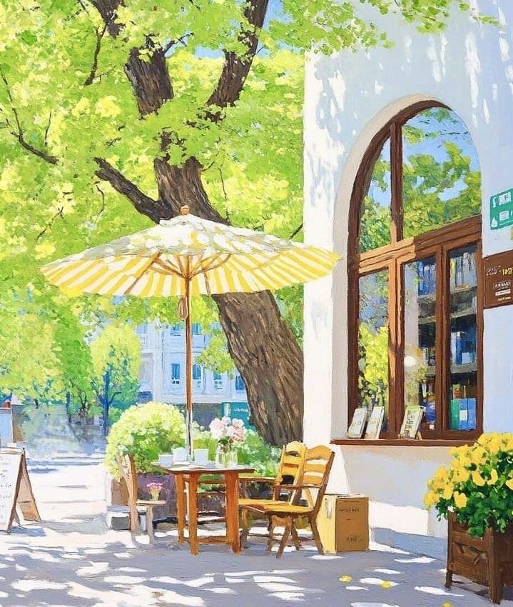 Outdoor cafe with tables and umbrellas on a market square