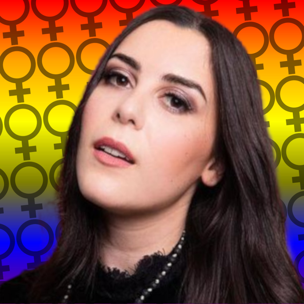 Close-up portrait of a woman with long dark hair in front of a rainbow background with female symbols