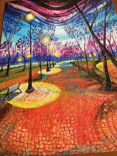 Colorful mosaic art showing park path with trees and dramatic sunset sky in purple and orange tones