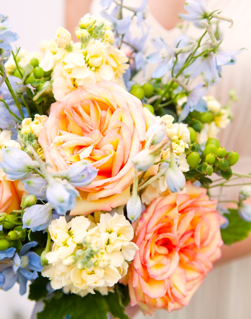 Pastel summer wedding bouquet with roses and peonies