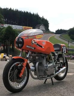 Orange vintage Laverda racing motorcycle with fairing at racetrack