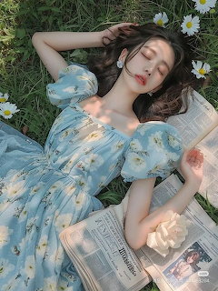 Woman in Blue Dress on Grass