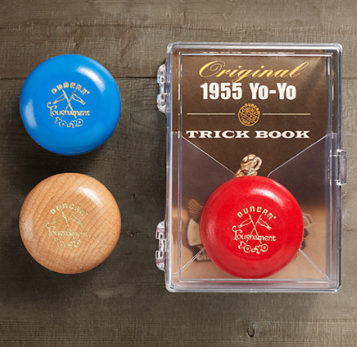 Three vintage Duncan yo-yos from 1955 with original packaging and trick book