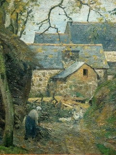 Impressionist painting of cottages and a figure walking along a village path