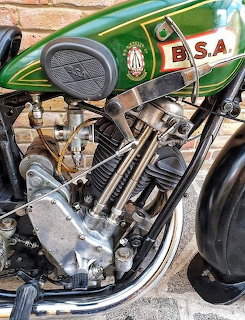 Vintage BSA SLOPER motorcycle engine with green and gold tank and exposed mechanical parts