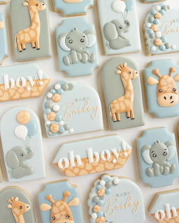 Pastel baby shower cookies with giraffe, elephant, balloon, and oh boy decorations