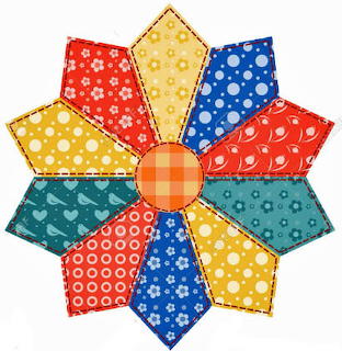 Patchwork fabric flower with multicolored pentagon petals in dot patterns around orange center