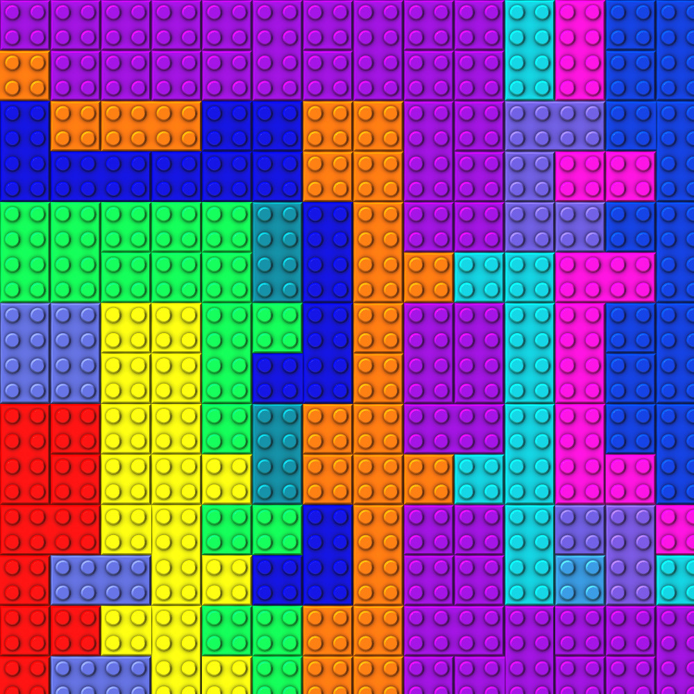 Colorful interlocking toy blocks arranged in an abstract pattern with red, blue, purple, green, yellow, and orange pieces