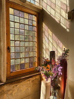 Sunlit Window with Flowers