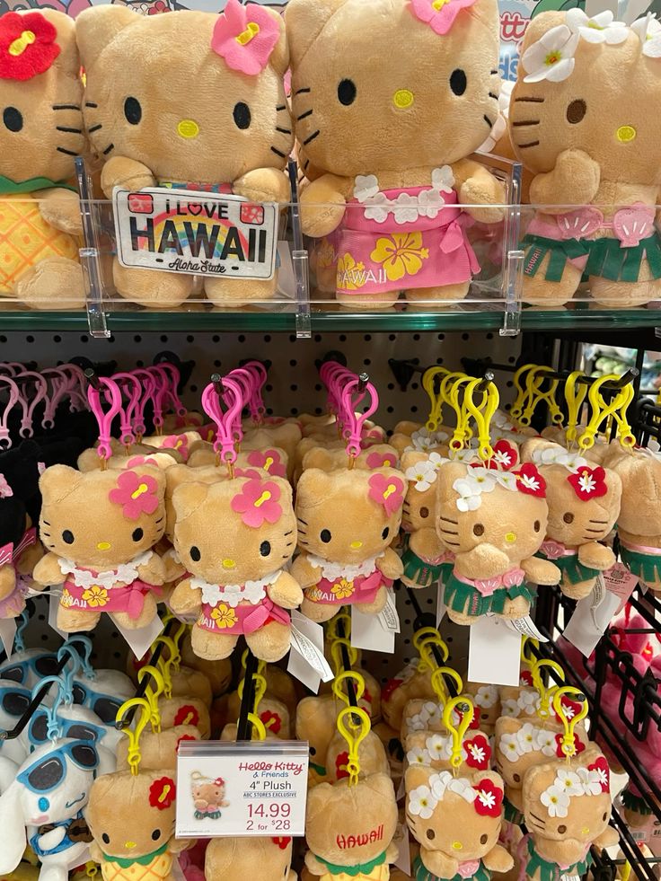 Hello Kitty plush toys dressed in Hawaiian tropical outfits with leis