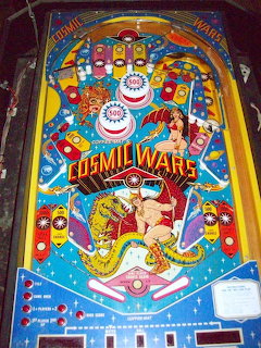 Vintage Cosmic Wars pinball machine with colorful sci-fi themed artwork and playfield