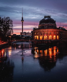 Bode Museum and Berlin TV Tower at sunset reflected in the Spree River