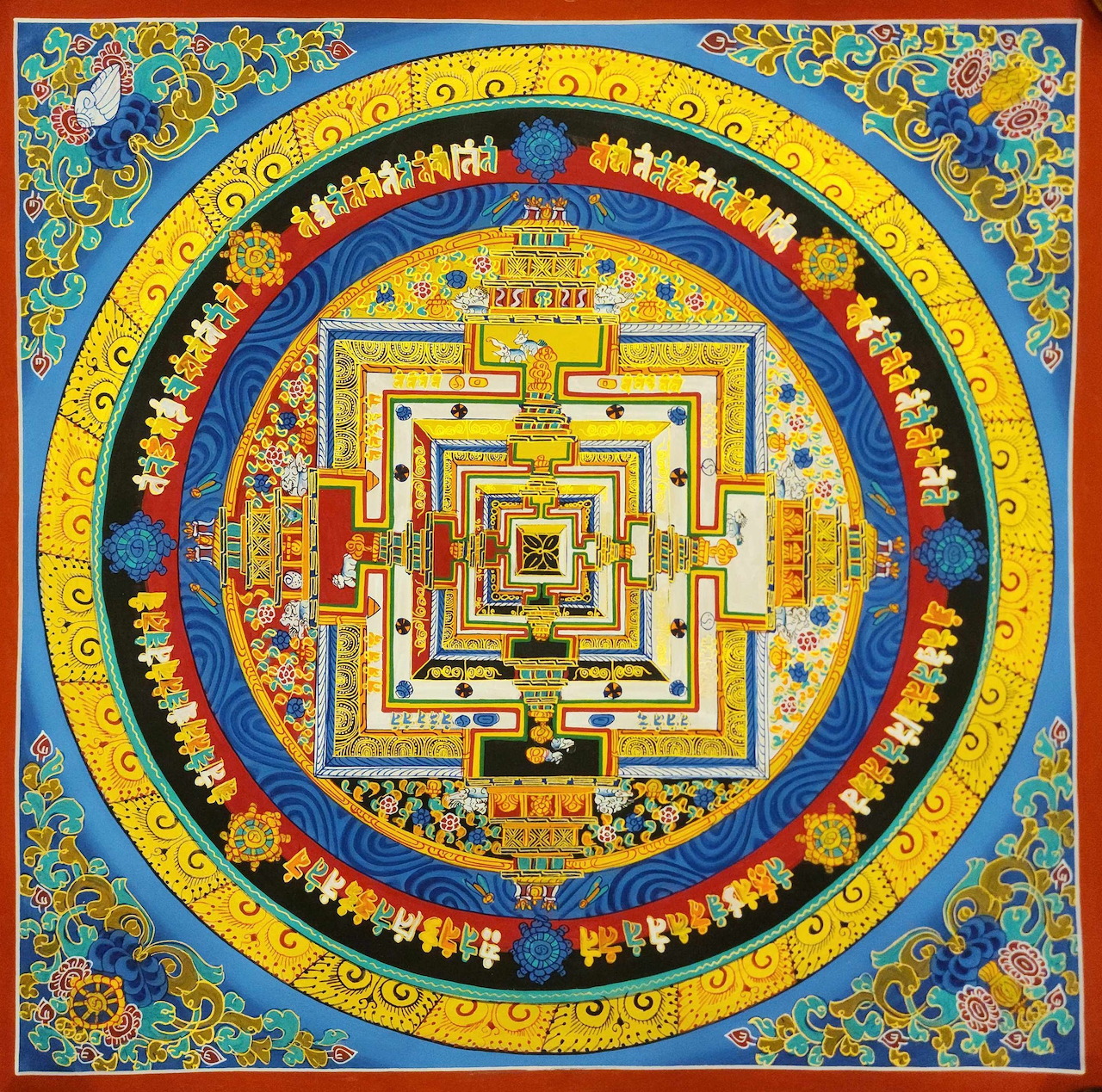Detailed Tibetan Buddhist mandala with concentric geometric patterns in gold, blue, and red on traditional thangka