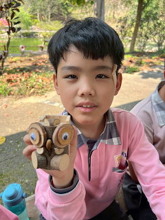 Boy Holding Wooden Owl