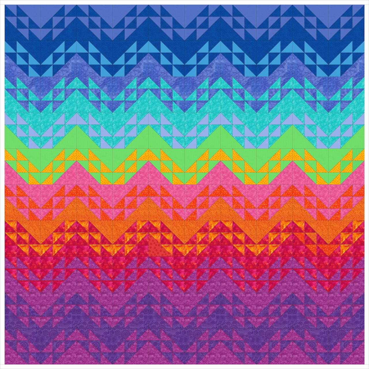 Rainbow chevron quilt pattern with zigzag stripes in blue, turquoise, yellow, pink, orange, red, and purple