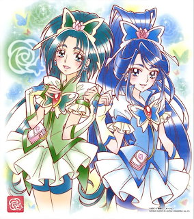 Anime illustration of Cure Mint in green and Cure Aqua in blue magical girl outfits