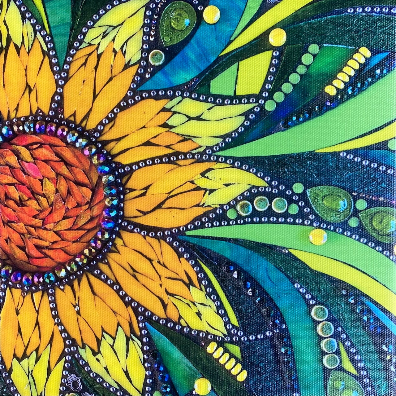 Colorful mosaic sunflower with yellow petals and beaded decorative patterns on blue and green swirling background