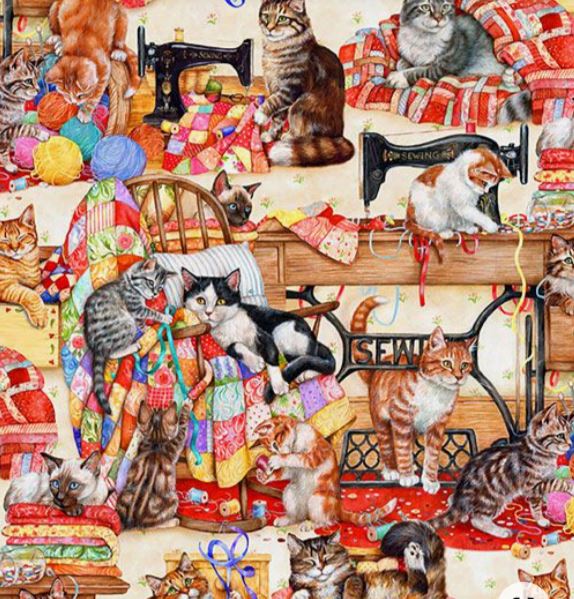 Cats playing around sewing machines surrounded by colorful quilts and craft materials