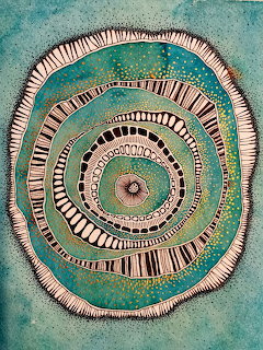 Turquoise and cream mandala with spiral concentric rings and geometric tribal patterns on textured background