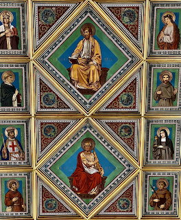 Ornate religious ceiling frescoes in diamond panels with gold borders showing saints and biblical figures
