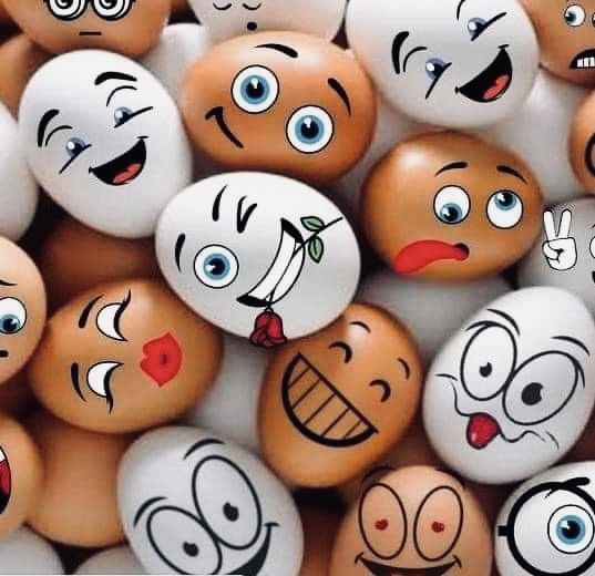 Painted Easter eggs with funny cartoon faces and expressions