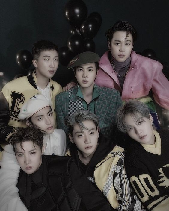 BTS K-pop group members posing together in a stylized portrait