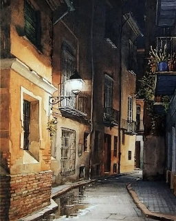 Watercolor painting of a narrow old European street lit by a single lamp at night