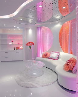 Futuristic living room with white curved furniture, pink and orange drapes, and bubble lighting