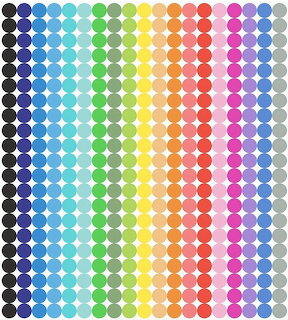 Grid of colorful dots arranged in rainbow gradient columns from blue to purple