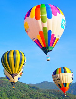 Hot Air Balloons Over Hills