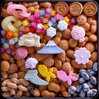 Assorted Japanese sweets and cookies with colorful flower shapes, Mount Fuji designs, and traditional wagashi treats