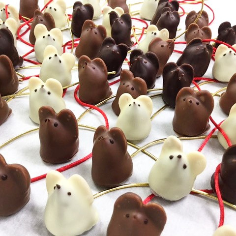 Group of dark, milk, and white chocolate mice truffles with almond ears