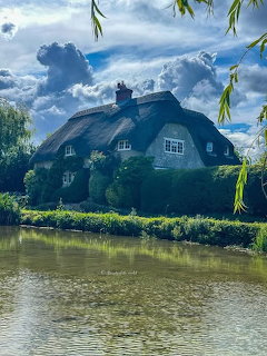 Thatched Cottage by Water