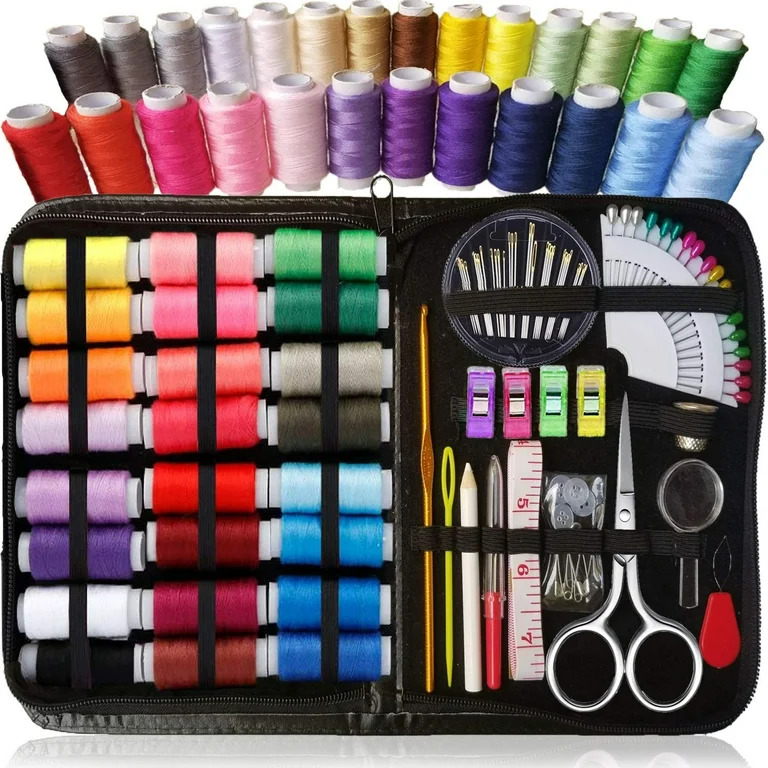 Colorful sewing kit with organized thread spools, scissors, needles, and tools in black case