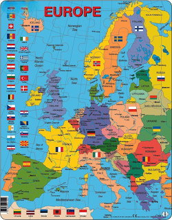 Political map of Europe with countries in different colors, capitals marked, and national flags displayed along the borders