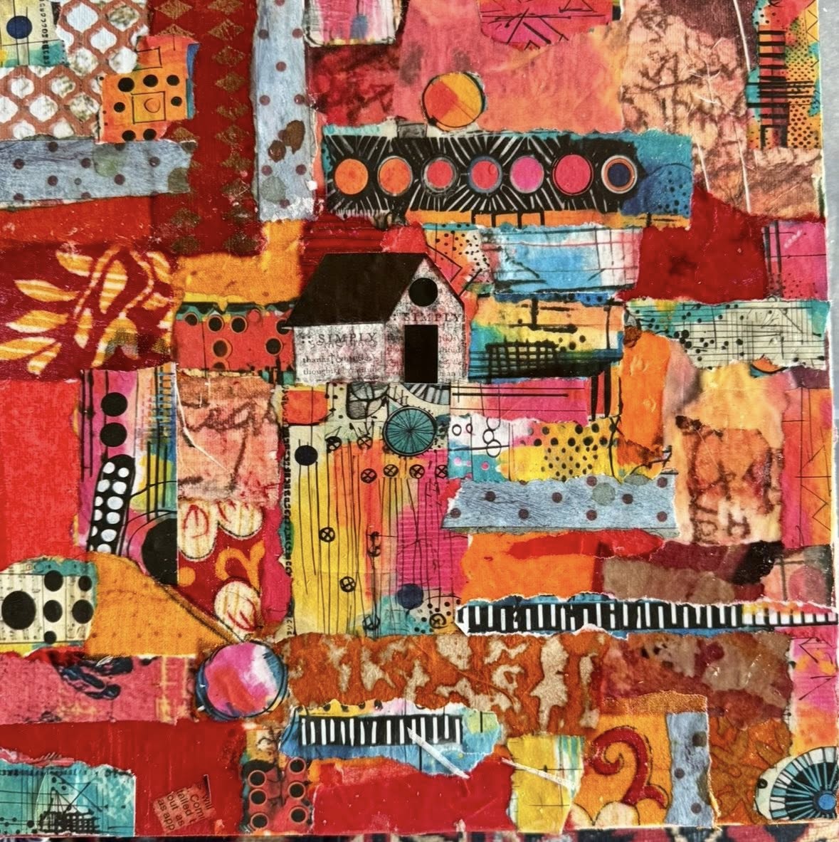 Colorful abstract mixed media collage with geometric patterns and layered textures in warm and cool tones