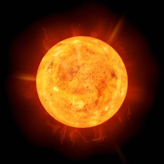 Bright orange sun with flares and surface texture on black background