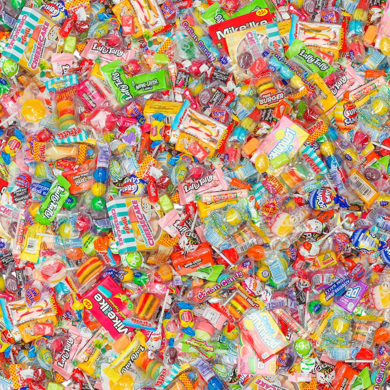 Overhead view of many colorful wrapped candies packed together