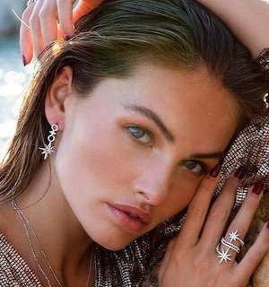 Portrait of woman with green eyes wearing elegant jewelry