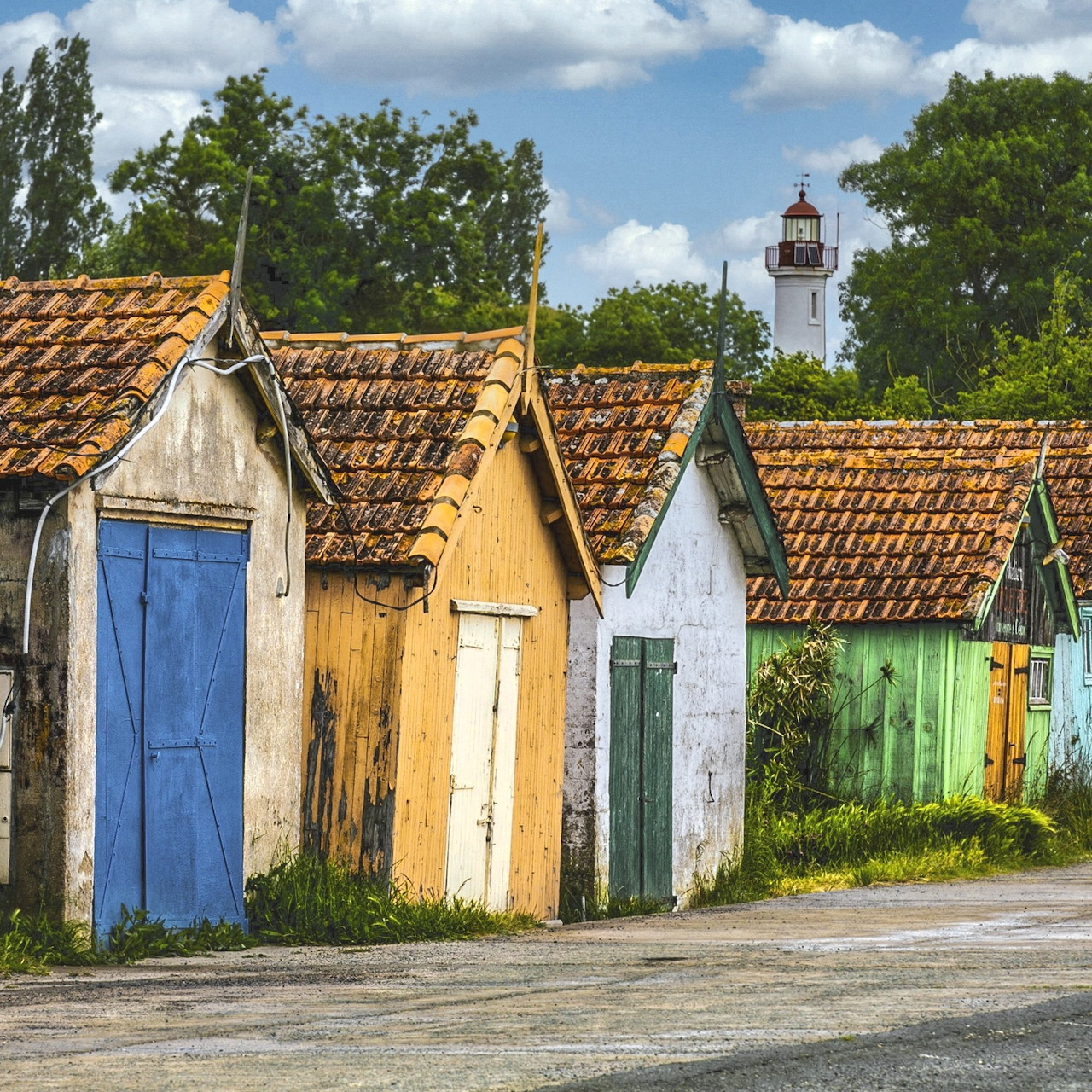 Colorful Huts and Lighthouse France