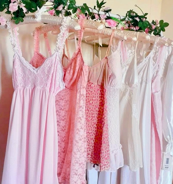 Pink and white slip dresses with fake flower vine decor in coquette style